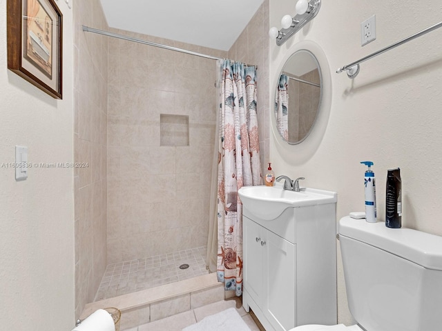 bathroom with toilet, tile patterned flooring, walk in shower, and vanity