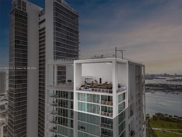 view of outdoor building at dusk