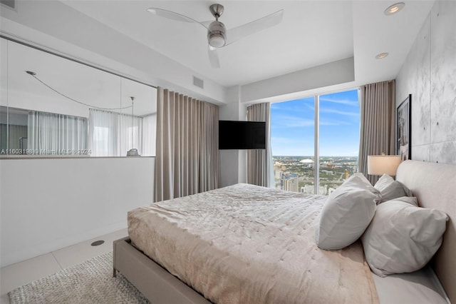 bedroom featuring tile patterned flooring and ceiling fan