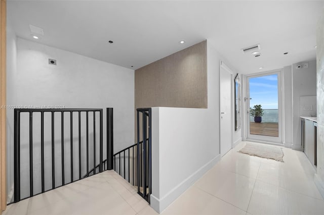 hallway featuring light tile patterned floors