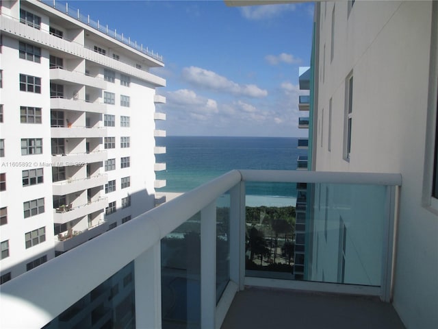 balcony featuring a water view