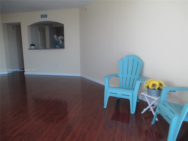 living area with hardwood / wood-style flooring