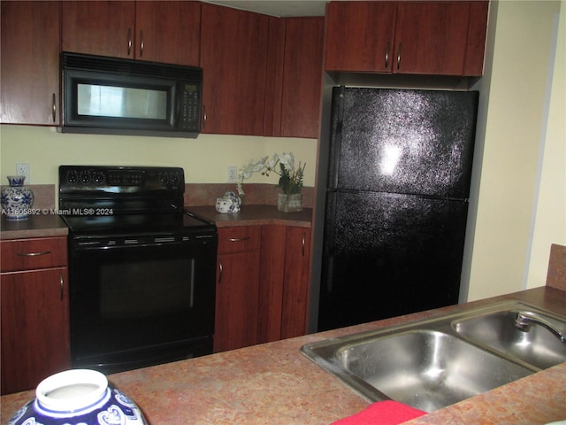 kitchen with sink and black appliances