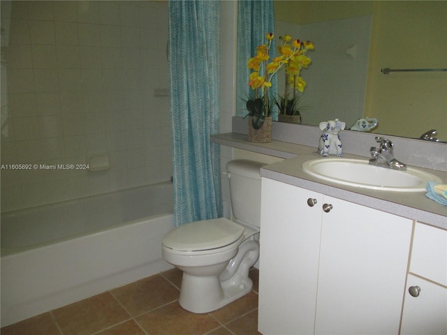 full bathroom with tile floors, shower / tub combo, toilet, and vanity