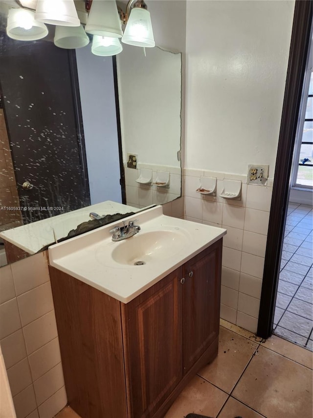 bathroom featuring tile flooring, tile walls, and vanity