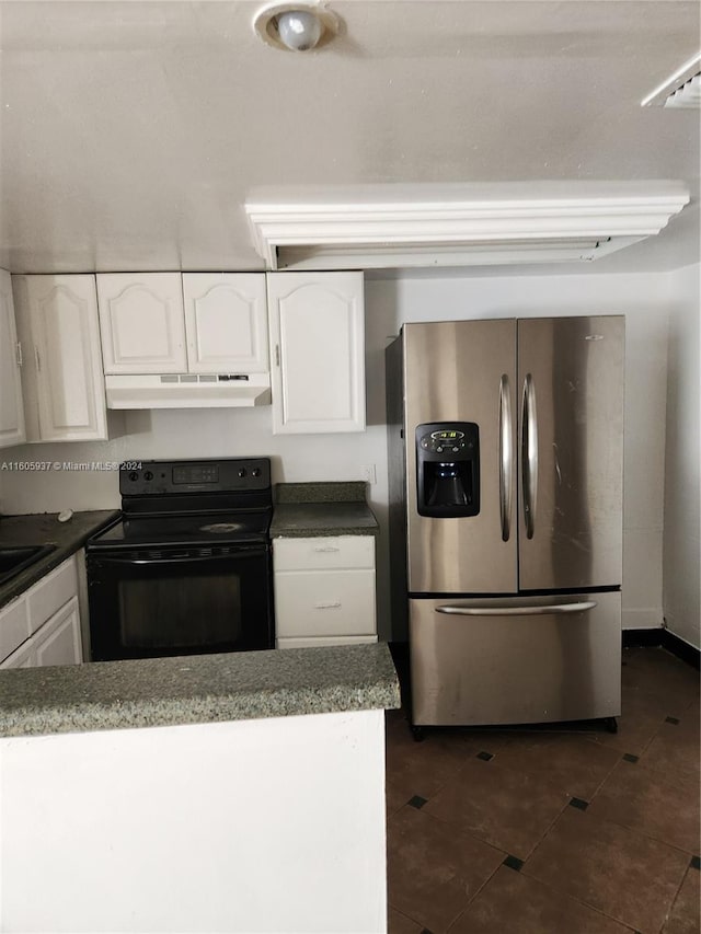 kitchen with white cabinetry, stainless steel fridge, electric range, sink, and dark tile floors