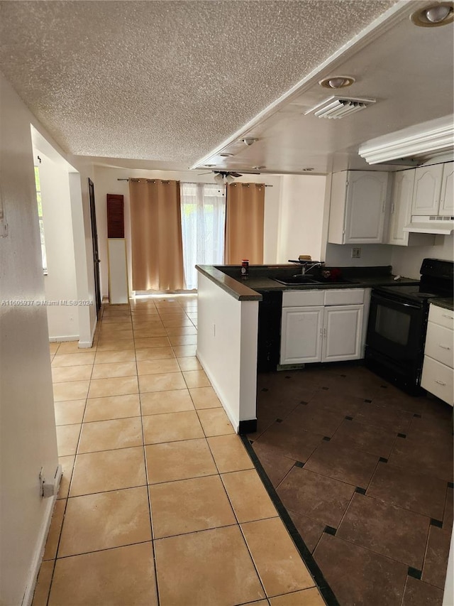 kitchen featuring white cabinets, sink, black range with electric stovetop, and light tile flooring