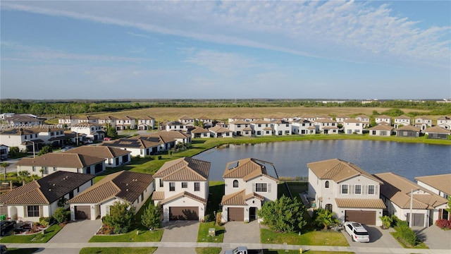 drone / aerial view with a water view