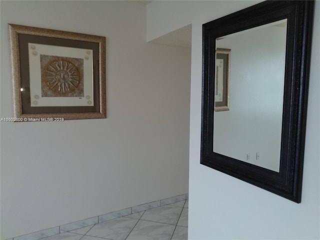 unfurnished room featuring light tile patterned floors