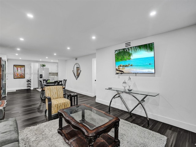 living room featuring dark hardwood / wood-style floors