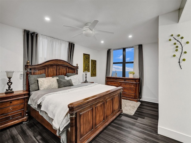 bedroom featuring dark hardwood / wood-style flooring and ceiling fan