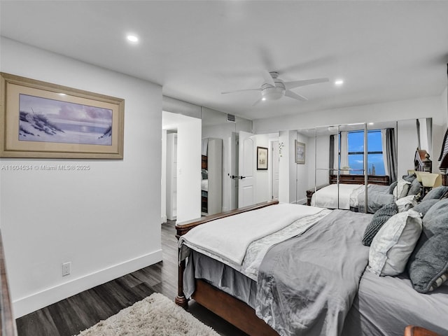 bedroom with ceiling fan and dark hardwood / wood-style floors