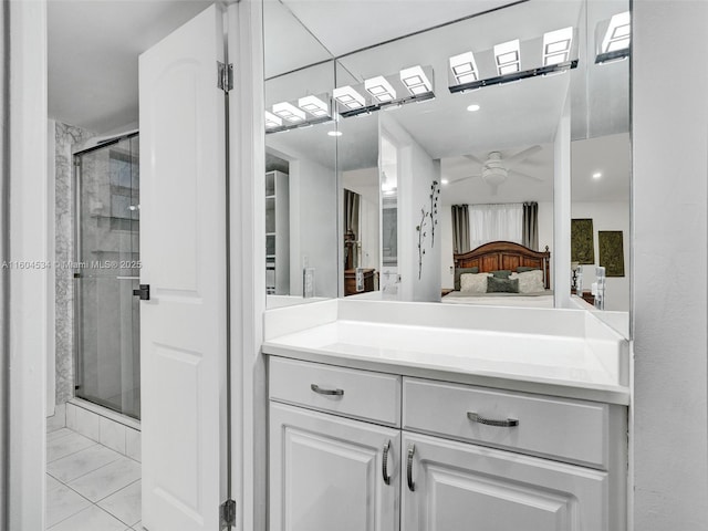 bathroom with vanity, walk in shower, and ceiling fan