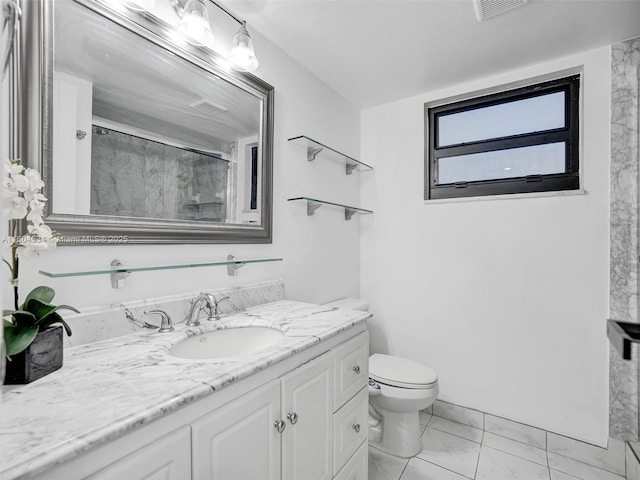 bathroom with a shower with door, vanity, and toilet