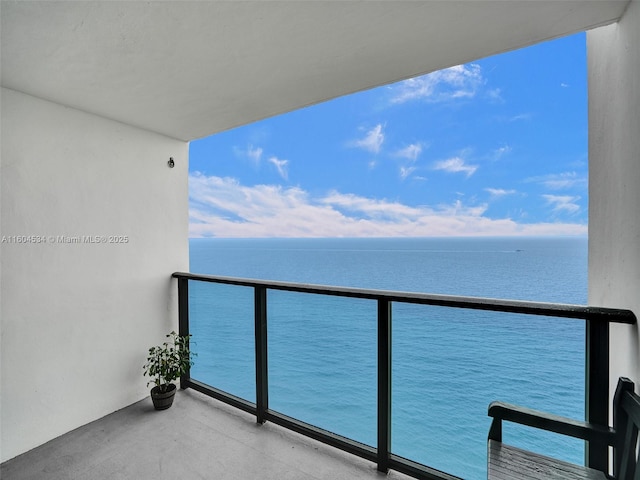 balcony featuring a water view