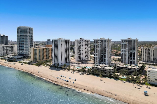 bird's eye view with a water view and a view of the beach