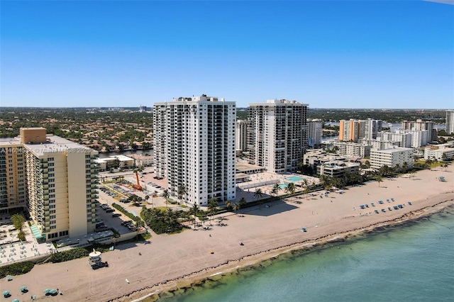 bird's eye view featuring a beach view and a water view