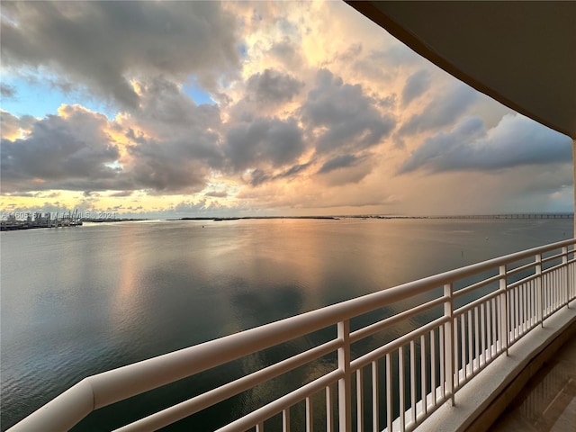 balcony at dusk with a water view