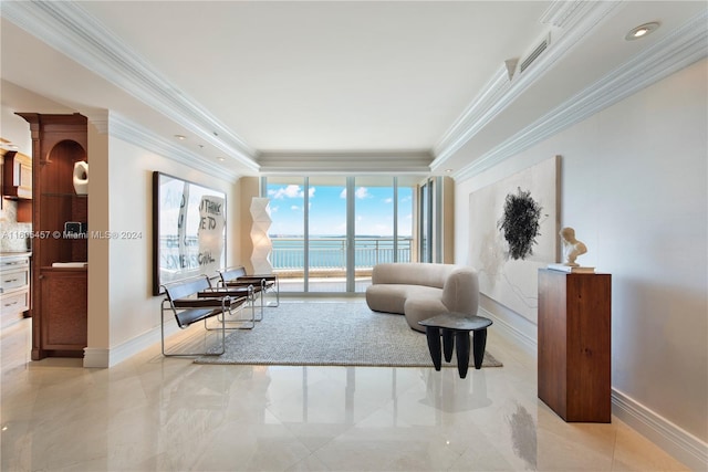 living room with a water view and ornamental molding