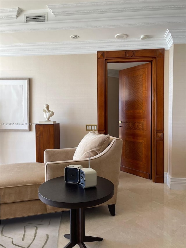 sitting room featuring ornamental molding