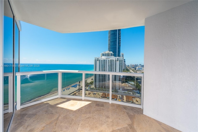 balcony with a view of city and a water view