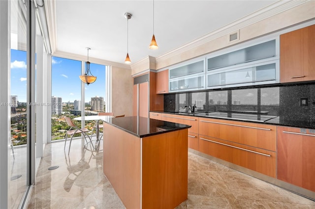 kitchen with tasteful backsplash, a center island, black electric stovetop, ornamental molding, and modern cabinets