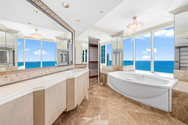 full bathroom featuring vanity, crown molding, a bath, and a water view