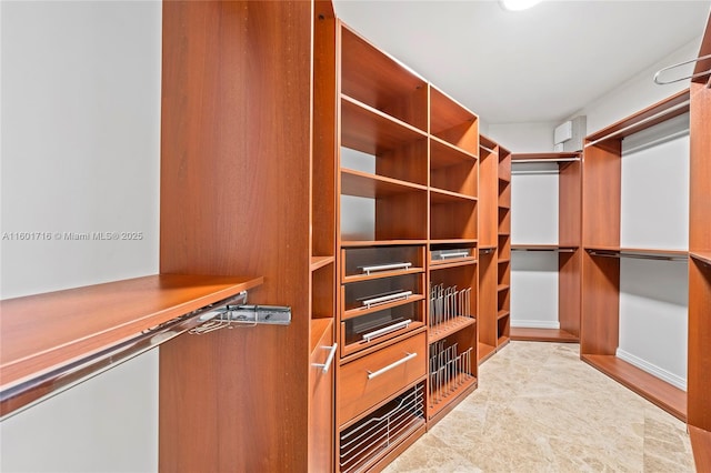 walk in closet featuring built in study area