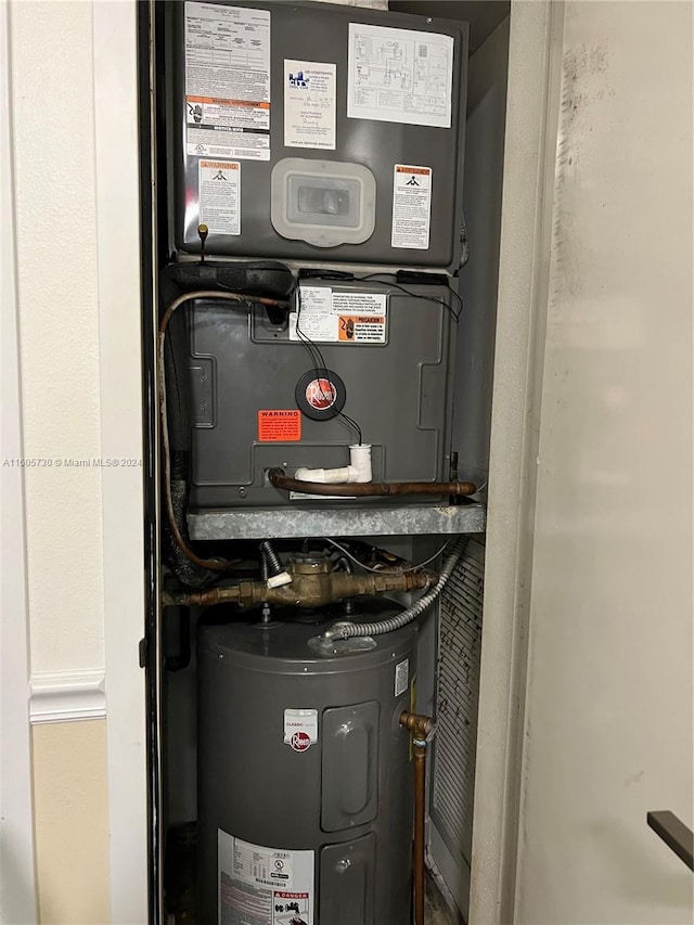 utility room featuring electric water heater