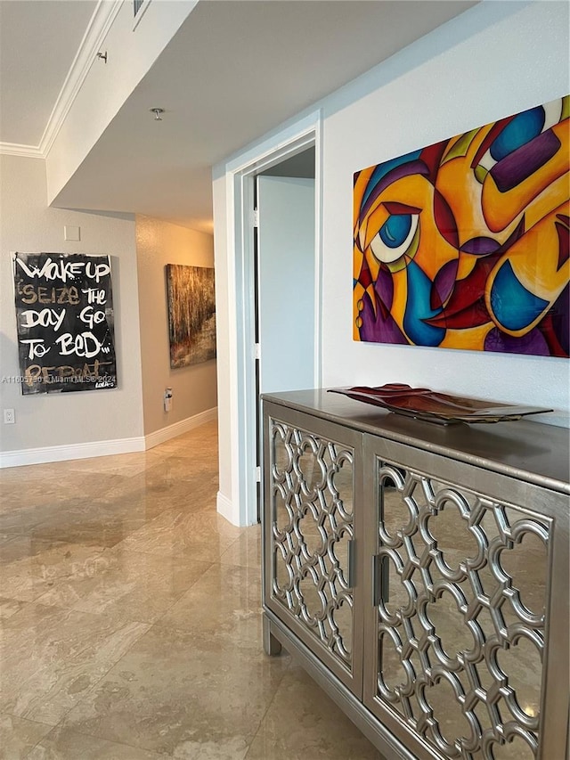 hall featuring ornamental molding and light tile flooring