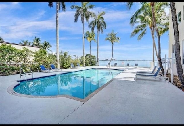 view of swimming pool featuring a patio area