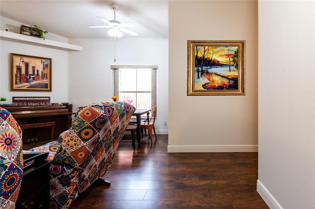 living room featuring dark hardwood / wood-style floors and ceiling fan