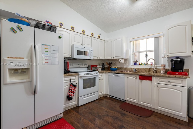 kitchen featuring white cabinetry, white appliances, dark hardwood / wood-style flooring, vaulted ceiling, and sink