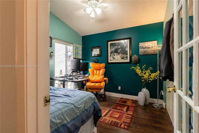 bedroom featuring wood-type flooring, ceiling fan, lofted ceiling, and a textured ceiling