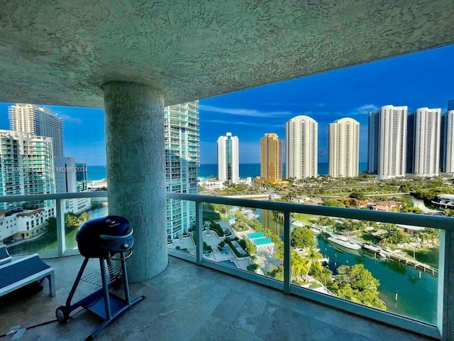 balcony featuring a water view