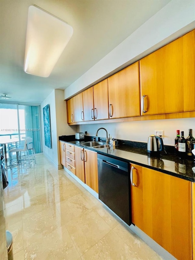 kitchen featuring black dishwasher, dark stone counters, and sink