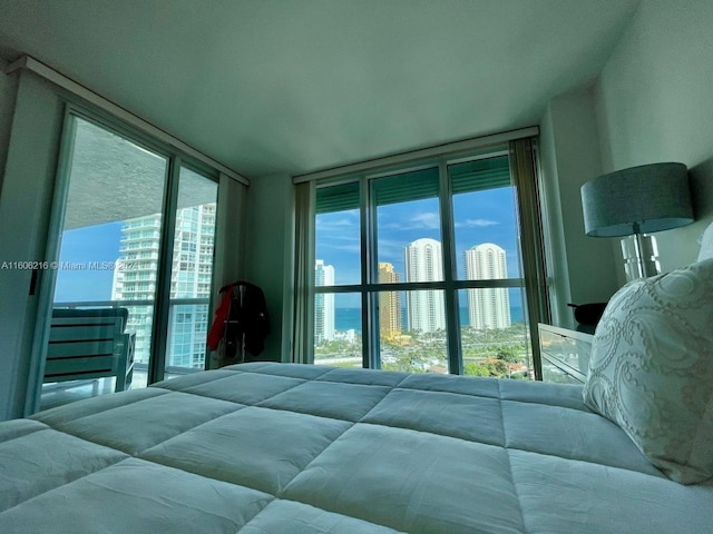 bedroom with floor to ceiling windows