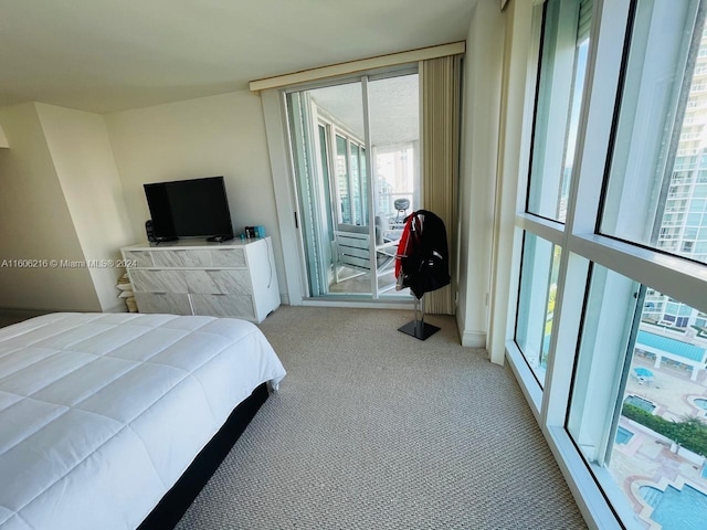 bedroom featuring light carpet