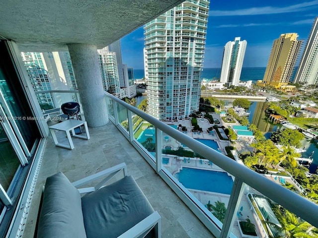 balcony featuring a water view