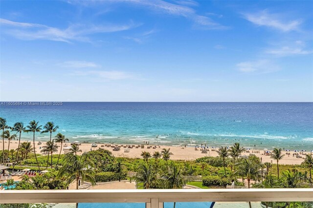 birds eye view of property with a view of the beach and a water view