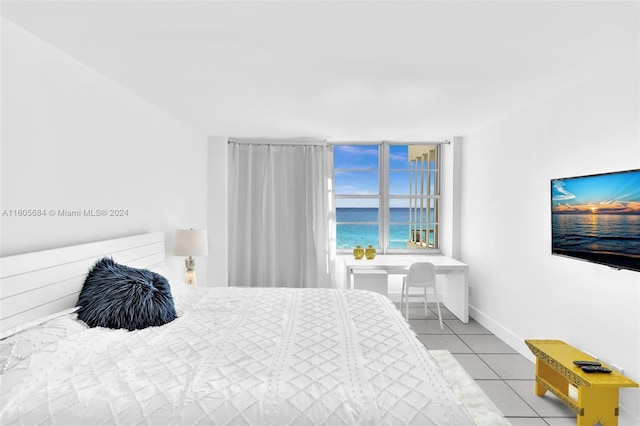 bedroom featuring light tile patterned flooring