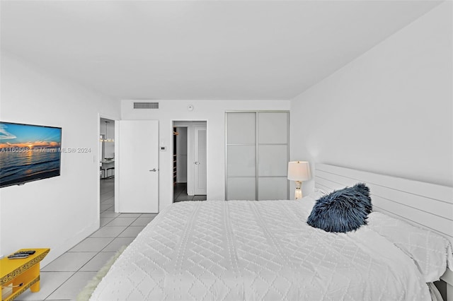 bedroom featuring light tile patterned flooring