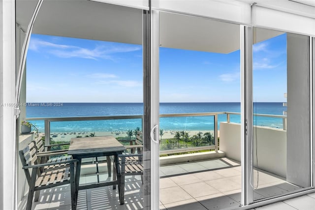 balcony with a view of the beach and a water view