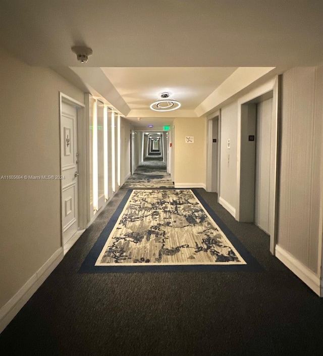 hall with dark carpet