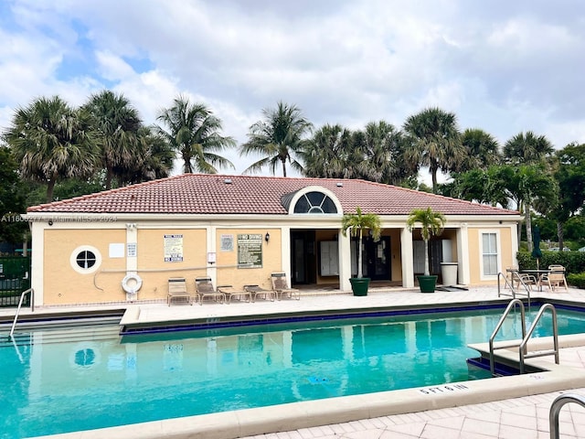 view of swimming pool with a patio