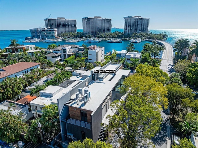 birds eye view of property with a water view