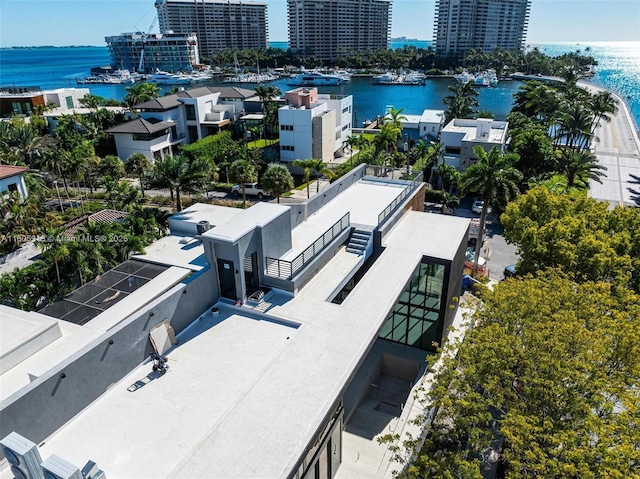 birds eye view of property with a water view