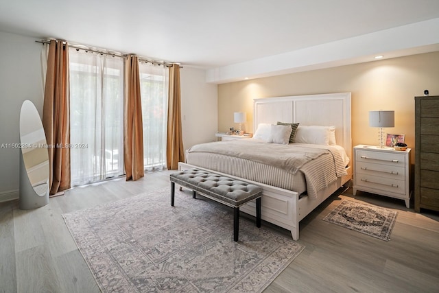 bedroom with light hardwood / wood-style floors