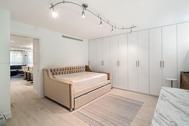 bedroom featuring light wood-type flooring