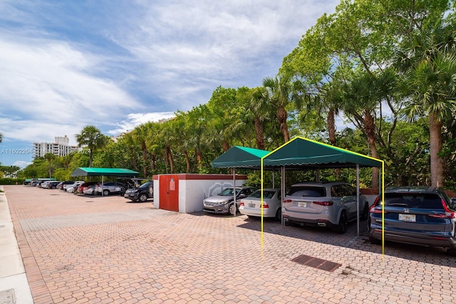 view of vehicle parking with a carport